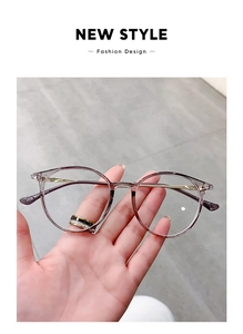 Detail of round transparent purple frames with sleek gold metal temples and model 9328