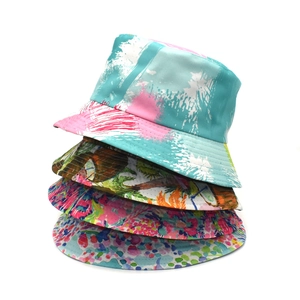 Artistic printed bucket hats for men and women featuring versatile reversible designs
