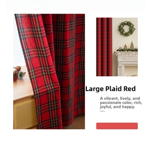 Close-up of red and green plaid Christmas curtain with thick fabric texture and soft drape
