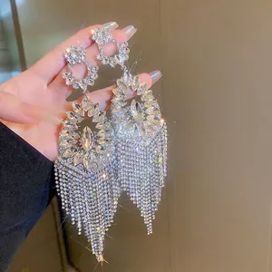 Elegant long tassel rhinestone drop earrings with silver metal flower hollow design