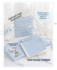 Detail showing the light blue striped quilted cotton book cover with interior card pockets