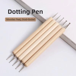 Close-up of five double-headed wooden stylus tools with different metal ball tips for clay