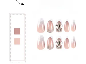 Detail view of French ombre press-on nails with luxury rhinestones and silver glitter