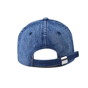 Detail of adjustable metal buckle and washed denim strap on the vintage baseball cap