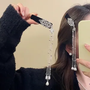 Chinese style velvet hair clip with silver hollow patterns and long pearl tassels for women