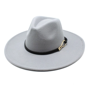 Close-up of a grey wool fedora hat featuring a black leather band and golden U-shaped buckle