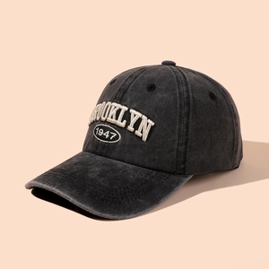 Detailed view of the 1947 Brooklyn embroidery on this washed black cotton baseball cap