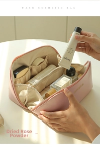 Detailed internal view of dusty rose cosmetic bag with multiple storage compartments