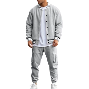 Detail of grey men's baseball jacket and cargo pants set with soft fleece texture