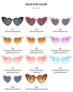 Eleven heart-shaped sunglasses in diverse glitter and solid colors with gradient lenses