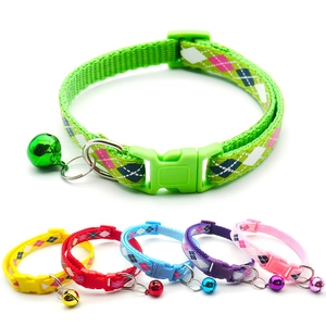 Detail of colorful Christmas pet collars with snowflake patterns and metal bells