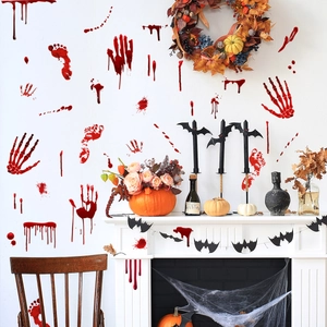 Spooky Halloween scene with bloody handprint and footprint decals on the wall
