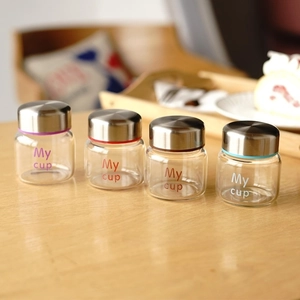 Mini high borosilicate glass jars with metal lids and colorful seal rings in a set of four