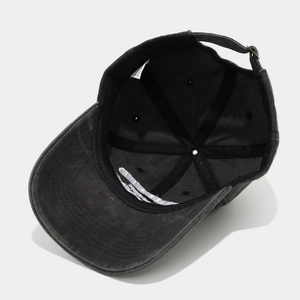 Detail view of the washed cotton baseball cap inner lining and metal buckle closure