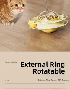 Detail of tumbler cat toy with spinning rings, treat dispenser and interactive yellow balls