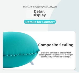 Detail view of the composite edge sealing on a teal inflatable travel U-shaped neck pillow