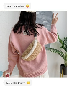 Rear view of model wearing a plush lamb wool crossbody bag in khaki and white