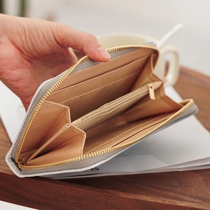 White textured long wallet for women with golden zipper and multiple card slots