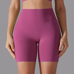 Detailed view of high-waisted seamless berry purple yoga shorts with wide waistband