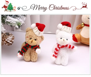 Mini Christmas teddy bears with scarves and hats displayed with festive pine cones