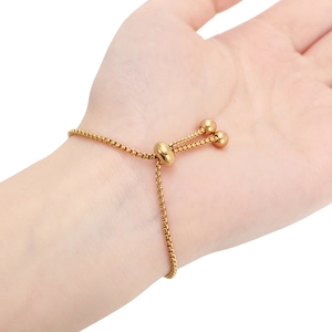 Adjustable gold plated box chain bracelet with sliding clasp for women shown on wrist