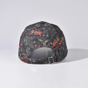 Detail view of adjustable metal buckle and artistic graffiti print on baseball cap back
