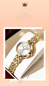 Detailed close-up of OLEVS gold chain watch with silver dial and Roman numerals