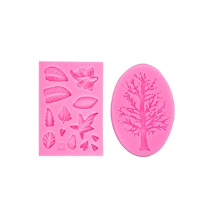 Pink silicone fondant molds featuring detailed tree and leaf patterns for cake decoration