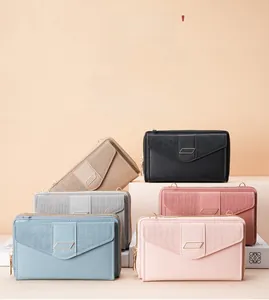 Detail showing various colors of slim PU leather crossbody phone bags with gold hardware