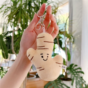 Plush ginger keychain with smiling face detail and silver metal ring for backpacks