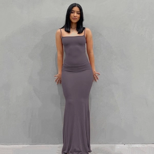 Detail showing the slim fit back design and long hem of the purple camisole maxi dress