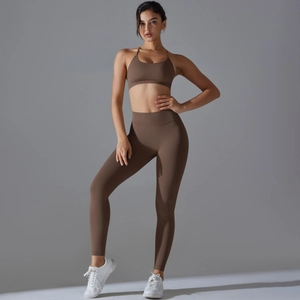 Detail view of dark brown seamless yoga set with thin straps and high waist leggings