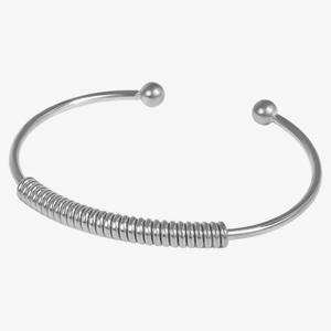 Macro view of silver 304 stainless steel open cuff bracelet with central spring coil detail