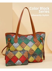 Detail of color-block patchwork tote set with crocodile texture and gold hardware