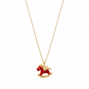 Elegant gold-tone horse necklace with red enamel wings and zircon shell on white background