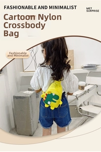 Detail shot of yellow nylon dinosaur crossbody bag with green dinosaur patterns