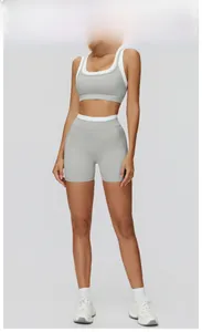 Detail view of pottery grey yoga set featuring contrasting white trim on racerback sport top