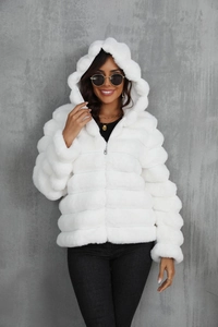 Detail of the white faux fur hooded jacket showing soft texture and premium plush material