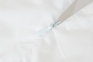 Macro shot of white invisible zipper on high-quality polyester maxi dress fabric