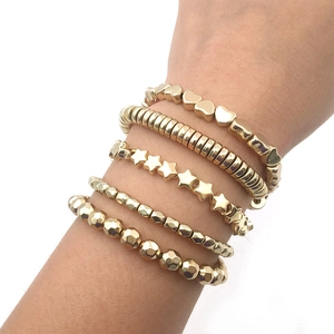 5-piece set of gold plated CCB bracelets featuring hearts, stars, and faceted beads