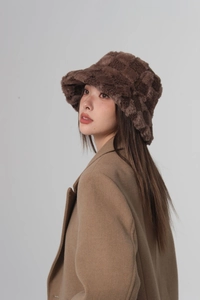 Side view of checkered plush bucket hat in brown and beige lamb wool texture