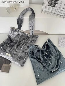 Chic velvet tote bag with pearl embellishments and top handles in silver and navy blue