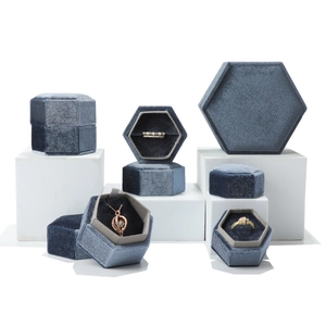 Dusty blue velvet hexagonal jewelry box set with necklace and ring cases on display