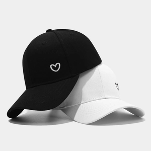 Classic cotton baseball caps in black and white with side heart embroidery detail