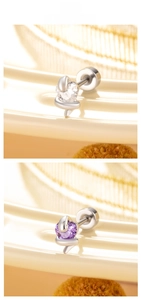 Macro detail of heart zircon snake earrings with polished silver stainless steel