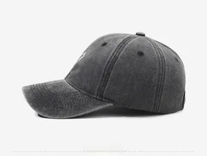 Side view of washed cotton baseball cap in charcoal grey with vintage distressed finish