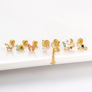 7-piece set of gold butterfly and floral stainless steel stud earrings with colorful gems