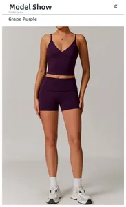 Detail of grape purple high-waisted fitness shorts and V-neck crop top in matte fabric
