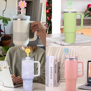 Collage of colorful tumblers with handles featuring cute 10mm daisy straw covers