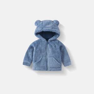 Detail of baby hooded plush jacket featuring cute bear ears and smooth resin zipper